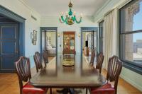 a dining room with a long table and chairs at Hotel Per La, Autograph Collection in Los Angeles