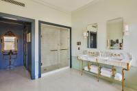 a bathroom with two sinks and a shower at Hotel Per La, Autograph Collection in Los Angeles