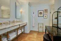 a bathroom with two sinks and a mirror at Hotel Per La, Autograph Collection in Los Angeles