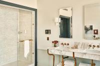 a bathroom with two sinks and a shower at Hotel Per La, Autograph Collection in Los Angeles
