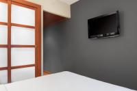 A television and/or entertainment centre at AC Hotel Ponferrada by Marriott