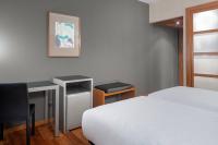 A bed or beds in a room at AC Hotel Ponferrada by Marriott