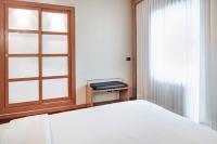 A bed or beds in a room at AC Hotel Ponferrada by Marriott