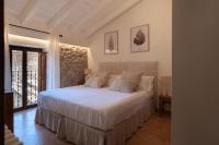 Postel nebo postele na pokoji v ubytování Es Petit de Valldemossa