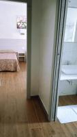 A bed or beds in a room at Hotel Parco Fiera