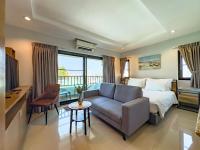 Postel nebo postele na pokoji v ubytování Nalanta Hotel Pattaya