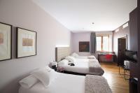Postel nebo postele na pokoji v ubytování Hotel Dolarea