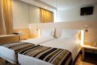 Park Hotel Porto Gaiaにあるベッド