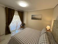 Postel nebo postele na pokoji v ubytování Elviria beach front apartment