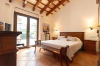 A bed or beds in a room at Villa con piscina Cala Morell