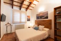 A bed or beds in a room at Villa con piscina Cala Morell