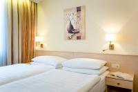 Postel nebo postele na pokoji v ubytování Hotel Scherer