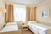 Postel nebo postele na pokoji v ubytování Hotel Scherer