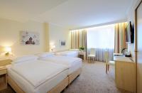 Postel nebo postele na pokoji v ubytování Hotel Scherer