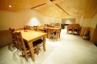 a large dining room with wooden tables and chairs at The Royal Vista in Shimla