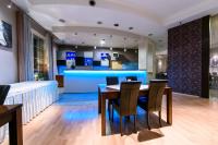 a dining room with a table and chairs at Hotel Nowy Dwór in Trzebnica