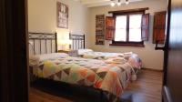 A bed or beds in a room at El Balcon del Horreo