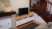 A television and/or entertainment centre at El Balcon del Horreo