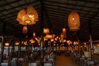 a large room with tables and chairs and lights at Sunsol Punta Blanca in San Pedro de Coche