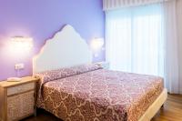 Posteľ alebo postele v izbe v ubytovaní Hotel Miramare