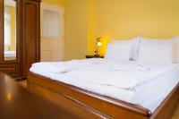 Postel nebo postele na pokoji v ubytování Villa Emausy
