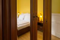 Postel nebo postele na pokoji v ubytování Villa Emausy