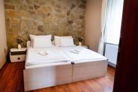 Postel nebo postele na pokoji v ubytování Villa Emausy