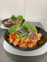 two plates of food sitting on a table at Lodge Cumbres de Chiloe in Castro