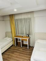 Postel nebo postele na pokoji v ubytování Dara Otel