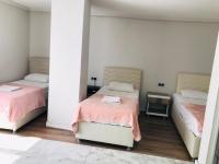 Postel nebo postele na pokoji v ubytování Dara Otel