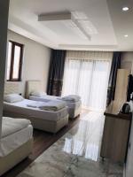 Postel nebo postele na pokoji v ubytování Dara Otel
