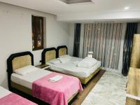Postel nebo postele na pokoji v ubytování Dara Otel