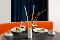a table with plates of food and glasses of wine at Hotel Royal Victoria, by R Collection Hotels in Varenna