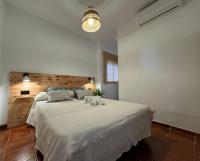 Postel nebo postele na pokoji v ubytování Apartamentos Alma de Zahara