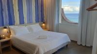 Posteľ alebo postele v izbe v ubytovaní Hotel La Martinica