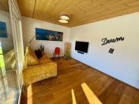 A television and/or entertainment centre at Alpenapart Singer - contactless check-in