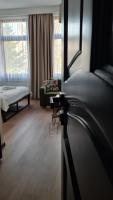 Posteľ alebo postele v izbe v ubytovaní Hotel Victoria