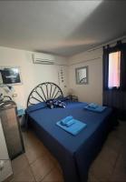 A bed or beds in a room at VILLA VITTORIA with PRIVATE HEATED SWIMMING POOL COMPLETE WITH HIDROMASSAGE FOR EXCLUSIVE USE , SEA VIEW, 150 METERS FROM THE BEACH