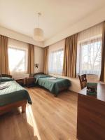 Posteľ alebo postele v izbe v ubytovaní Hotel Victoria