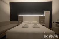 Albergo Augusta B&Bにあるベッド