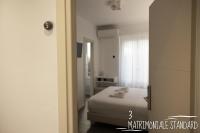 Albergo Augusta B&Bにあるベッド