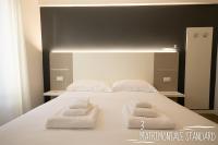 Albergo Augusta B&Bにあるベッド
