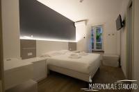 Albergo Augusta B&Bにあるベッド