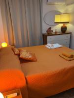A bed or beds in a room at VILLA VITTORIA with PRIVATE HEATED SWIMMING POOL COMPLETE WITH HIDROMASSAGE FOR EXCLUSIVE USE , SEA VIEW, 150 METERS FROM THE BEACH