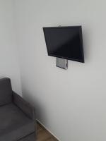 TV a/nebo společenská místnost v ubytování Coral Boutique Apartments