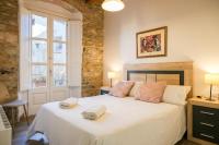 Postel nebo postele na pokoji v ubytování Ganganell Centre Apartamento con Patio