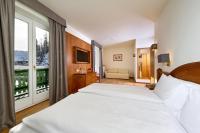 Posteľ alebo postele v izbe v ubytovaní Grand Hotel Misurina