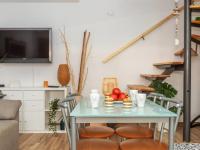 Televízia a/alebo spoločenská miestnosť v ubytovaní Holiday Home Gardenia by Interhome