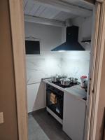 A kitchen or kitchenette at MeliKris home
