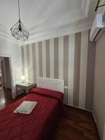 A bed or beds in a room at MeliKris home